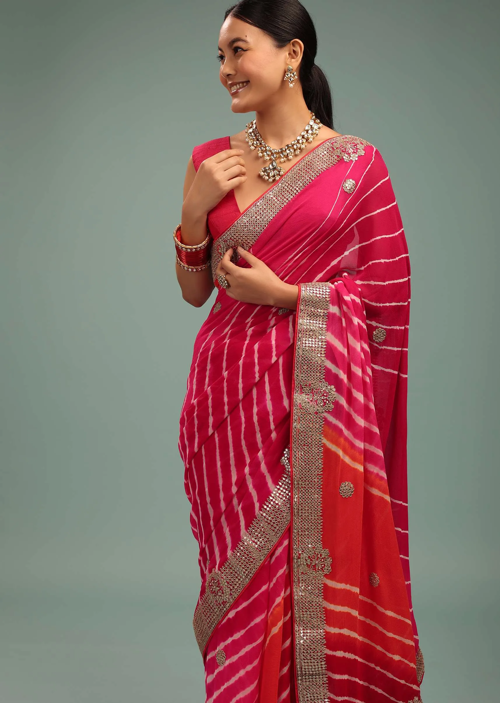 Gradient Red & Pink Leheriya Saree In Georgette With Jaipuri Gotta Work Border And Tassel Pallu