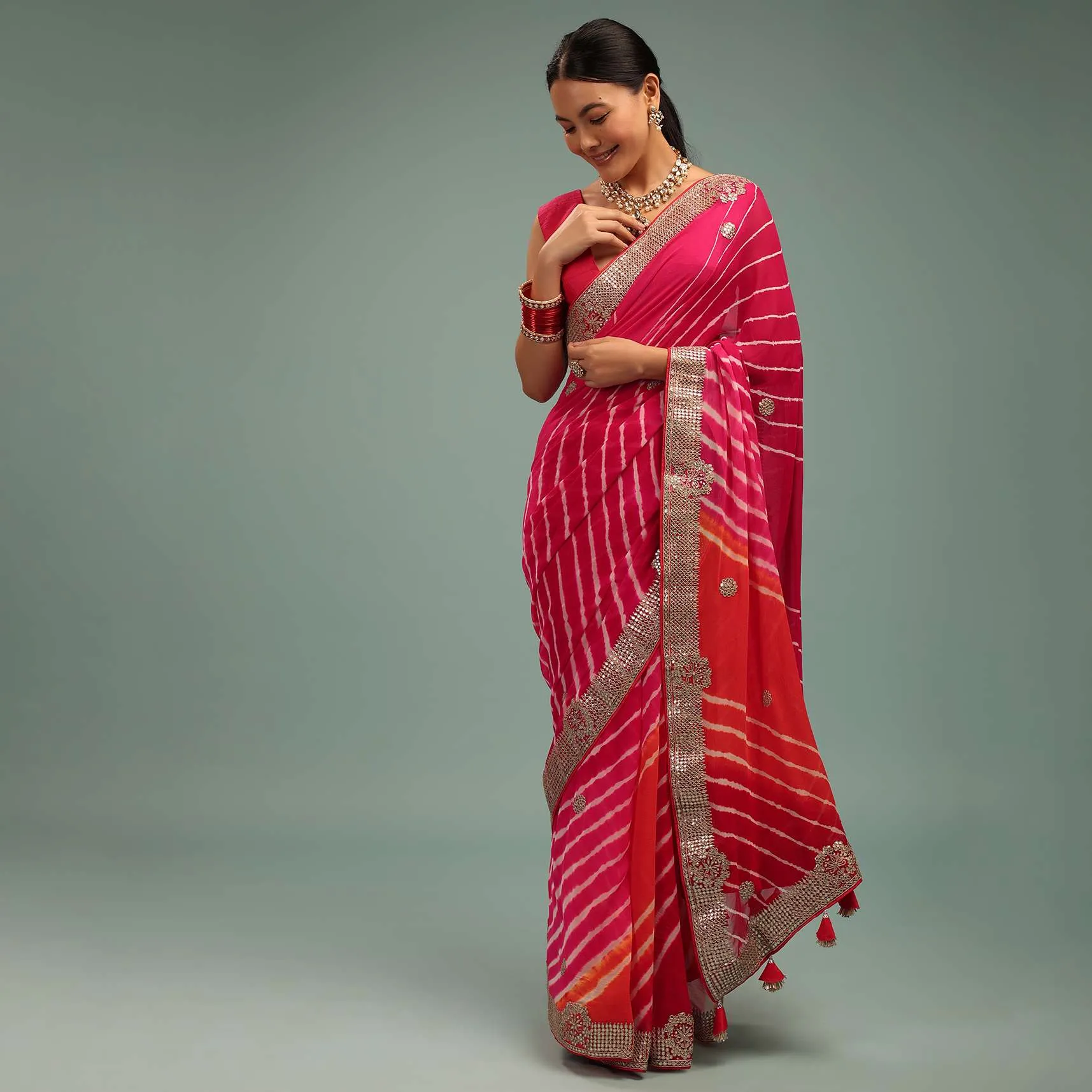 Gradient Red & Pink Leheriya Saree In Georgette With Jaipuri Gotta Work Border And Tassel Pallu